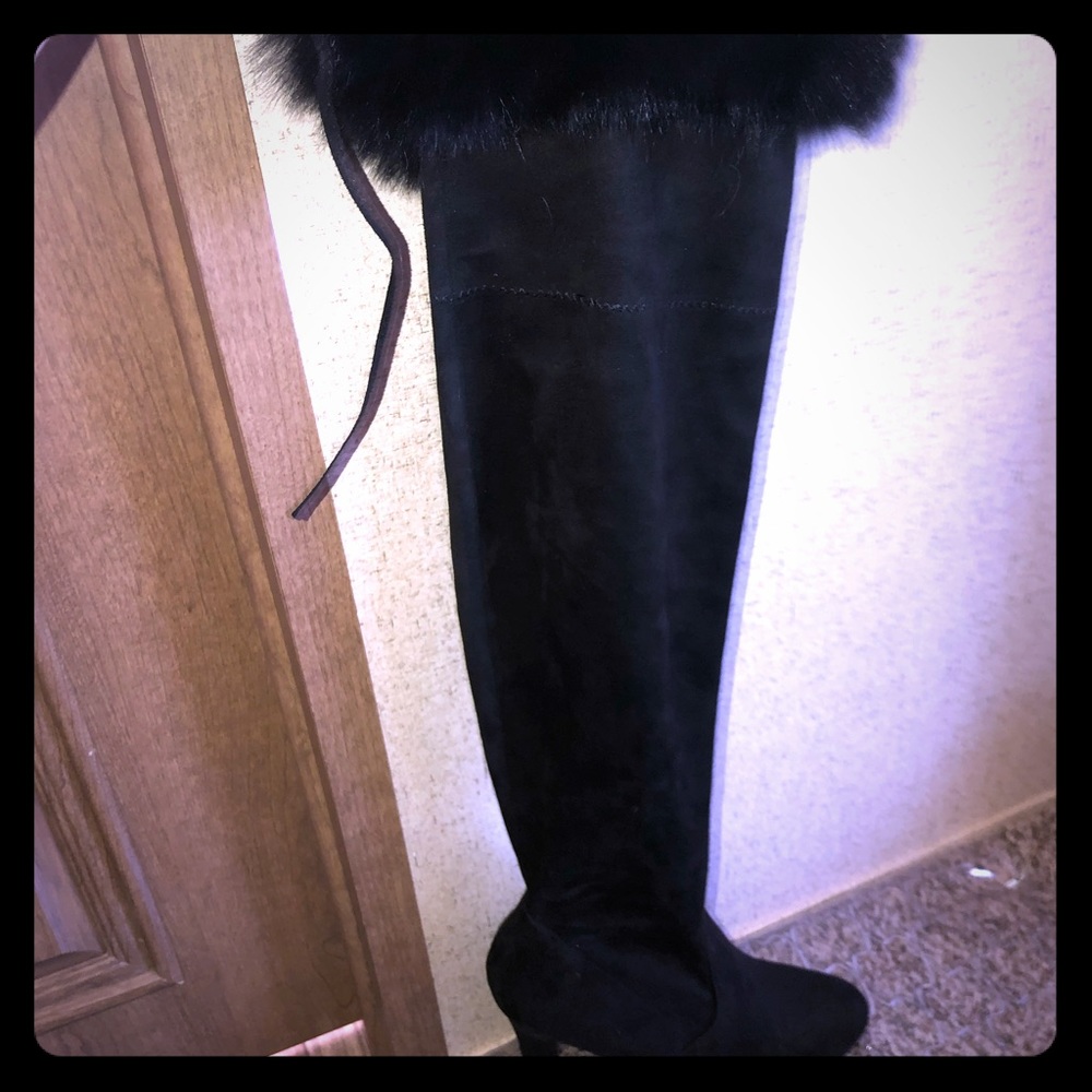 Knee high boots with fox fur